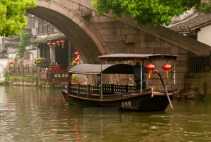 WUZHEN TOWN, ZHEJIAN, CHINA Traditional boat in Wuzhen Water Town, Zhejiang, China, photographed by Annamaria DiSanto