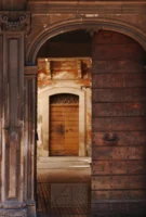 Traditional wooden doors in Bosa, Sardinia, Italy, photographed by Annamaria DiSanto