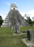 TEMPLE OF THE GREAT JAGUAR, TIKAL, GUATEMALA Temple of the Great Jaguar (Temple I) at the ancient Maya city of Tikal, Guatemala, photographed by Annamaria DiSanto
